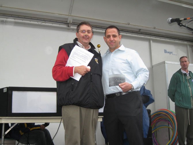 Sully District Supervisor Michael Frey (left) and Centreville Day Business Citizen of the Year Fouad Qreitem of Paisano’s and Bella Pizza.