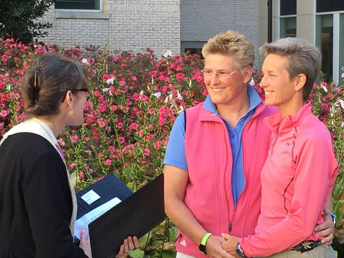 Yvonne Landis and Melody Mayo of Falls Church were wed by Unitarian Universalist Congregation of Fairfax Rev. Laura Horton-Ludwig on Oct. 6, becoming the first same-sex couple wed legally in the county.
