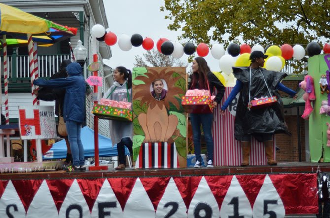 Members of the senior class of 2015 on their float in the Herndon Homecoming Parade held in downtown Herndon. The class of 2015 won the Richard F. Downer Theme Award. The parade was held despite wet weather.