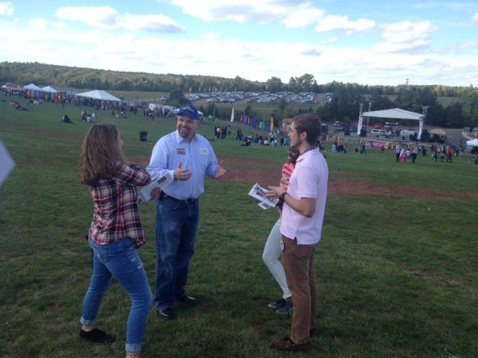 Libertarian candidate Marc Harrold talks with festival-goers at the 2014 NOVA Pride, held Oct. 5 in Centreville.
