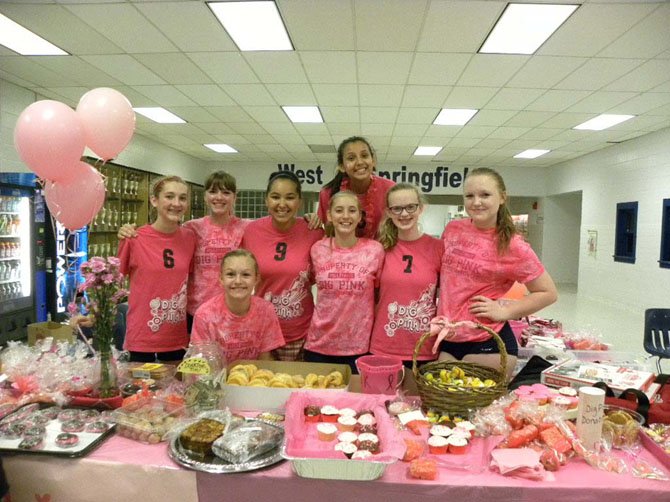 West Springfield High School Spartans Freshman volleyball team staff the bake sale table during the Dig Pink event on Tuesday, Oct. 14 in Springfield.