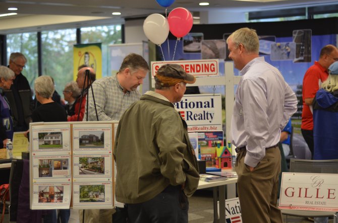 Reston Association hosted a home and garden expo at Reston Association headquarters in October. Jesse Morrow, a realtor representing Reston-based National Realty provided information about his company.