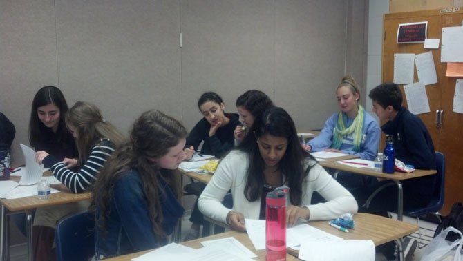 Student tutors help fellow classmates with their writing skills during a lunch writing center session.
