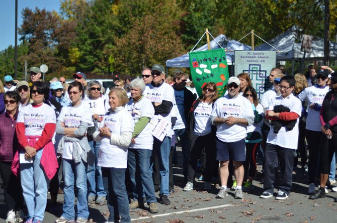 Participants gather for the Oct. 19 Cornerstones community walk from Embry Rucker Community Shelter to St. Anne’s Episcopal Church and back. 