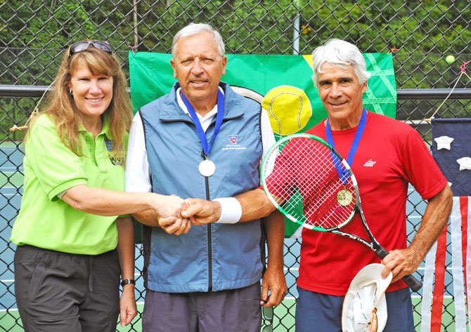 Men's Doubles winners for age bracket 60-69, David Lacsamana and Barry Herrmann being congratulated by Anne Chase, Recreation Manager for Fairfax parks.