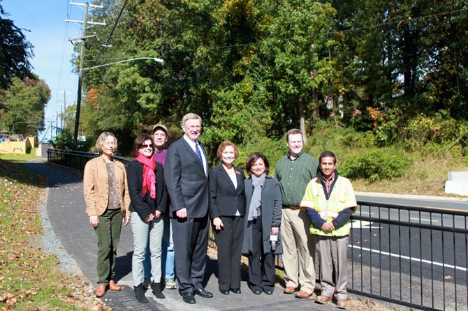 Dranesville Supervisor John Foust poses with local residents and county staff at the unveiling of a new trail by Lewinsville Road on Oct. 20.
