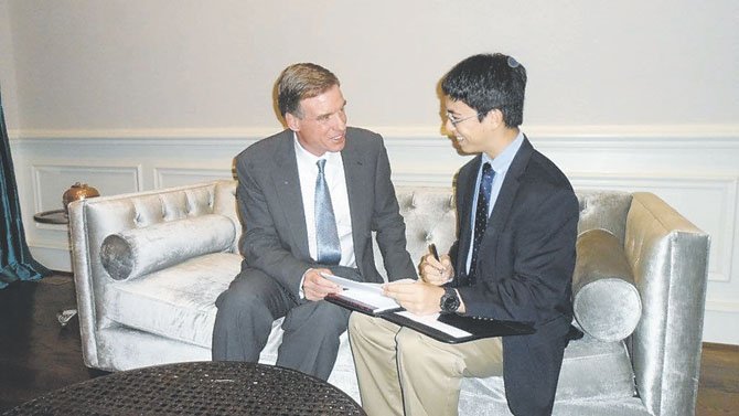 Great Falls student William Mullen, 15, interviews Sen. Mark Warner (D-Virginia).