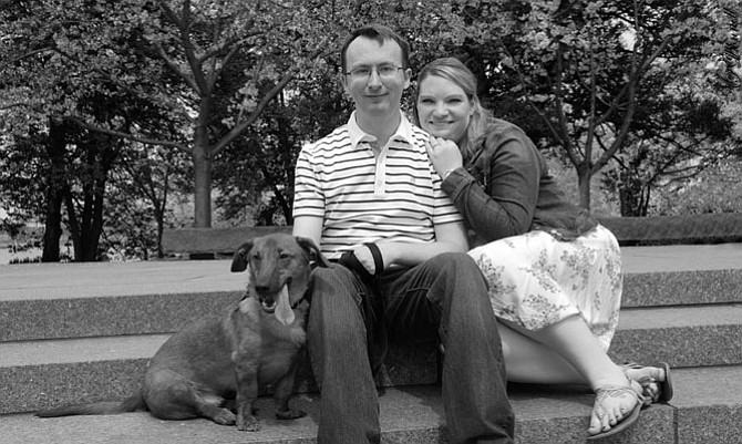 Sara and Thomas Sadler with their rescue dog Cayden, June’s Dog of the Month.