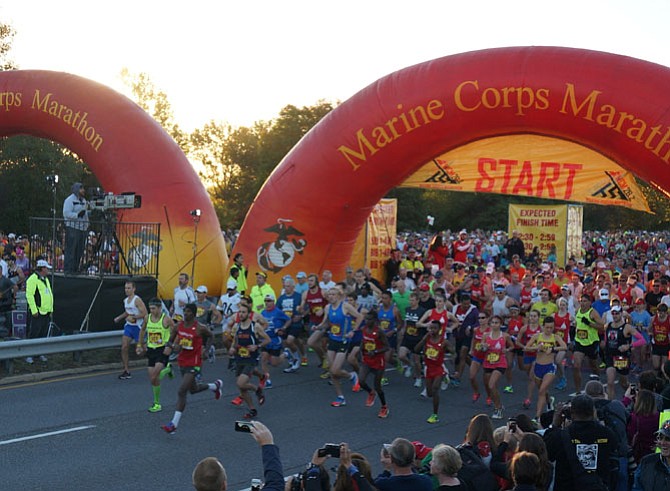 Runners take off at the start of the 39th Marine Corps Marathon Oct. 26 in Arlington.