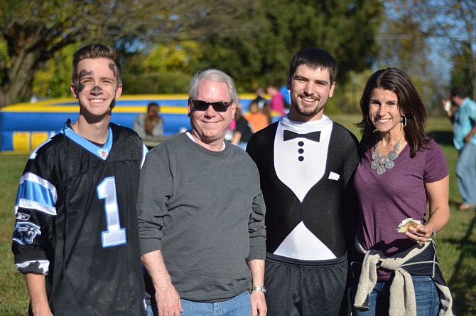 Director of Herndon Trinity Presbyterian Church Youth Ministry Program Lee Cook, Rev. Stephen Smith-Cobbs, intern youth leader Jake Killian and Rev. Rebecca Messman pose for a photo at the 2014 October Fall Festival.