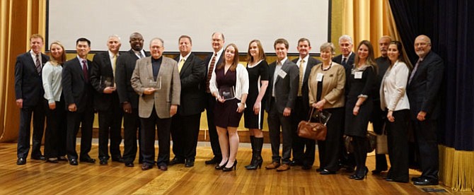 Board chair Joe Haggerty, left, and CEO John Long, right, pose for a photo with honorees of the 2014 Alexandria Chamber of Commerce Business of the Year Awards Oct. 22 at the George Washington Masonic Memorial. 
