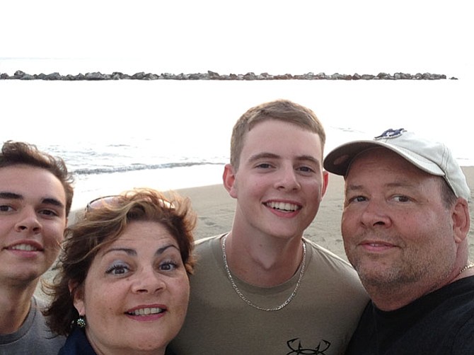 (From left) Alex, Sylvie, Nick and Steve Balenger pose for a family selfie on Nevis Island in Aug. 2014.
