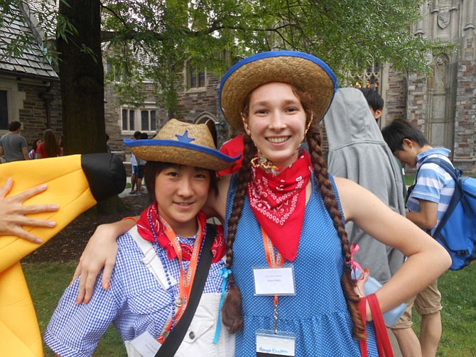 Margot Baden, a junior at W.T. Woodson (right), with her roommate Hitomi Nakashima, participating in Independence Day celebration. 