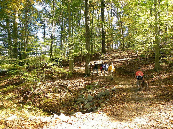 Northern Virginia Hiking Club (NVHC) members hike Lake Accotink Trail in Springfield, on Sunday, Oct. 26.
