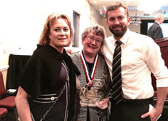 Mary Kay Downes is flanked by daughter Kathy Shoreman and son C.J. Downes at the celebration.
