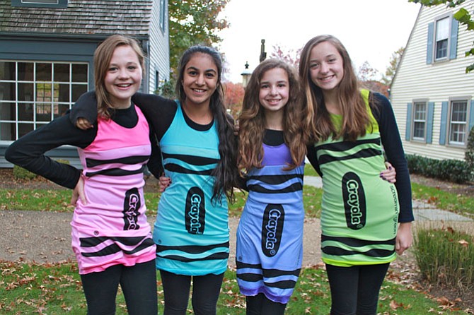 Twelve-year-old friends Emily Tracy, Sameen Saed, Emma Gatti and Lauren Tracy dressed up as Crayons for this year’s Great Falls Spooktacular on Oct. 31.
