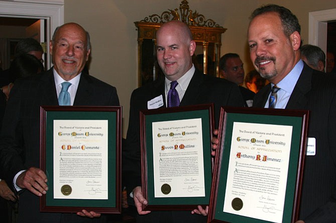 From left: Former Rector C. Daniel Clemente and former Board of Visitors members Steven Mullins and Anthony Jimenez receive honors for their terms.
