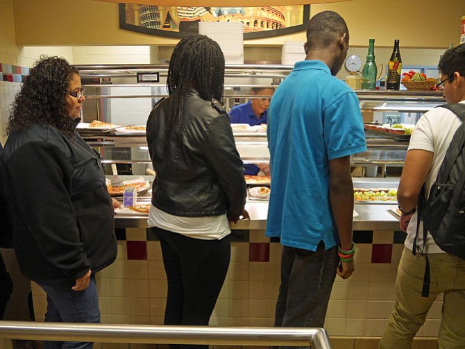 Students move through Napper’s pizza line quickly to choose pepperoni (the big favorite) pizza, cheese or the "speciality of the day" which is barbecued chicken on this Homecoming Friday.