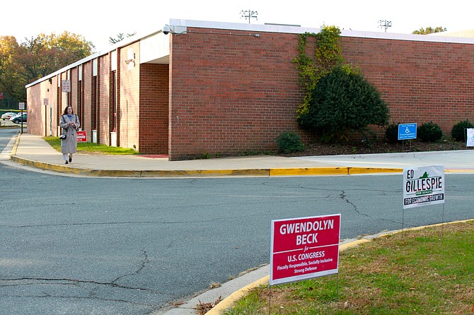 A voter exits the polls at McLean High School on Tuesday.
