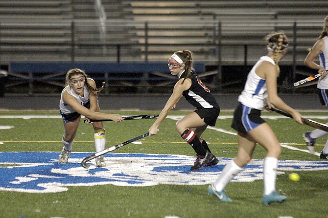 Fairfax senior captain Meg Robertson, left, scored the game-winning goal against Herndon in the 6A North region semifinals on Tuesday night at Fairfax High School.