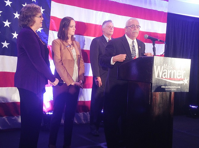 Congressman Gerry Connolly, flanked by his wife Cathy, his daughter Caitlin, and Virginia Governor Terry McAuliffe delivers his victory speech at a Democratic Election Night gathering in Arlington. Connolly was elected to a fourth term in the U.S. House of Representatives. It marked his 10th consecutive election victory.
