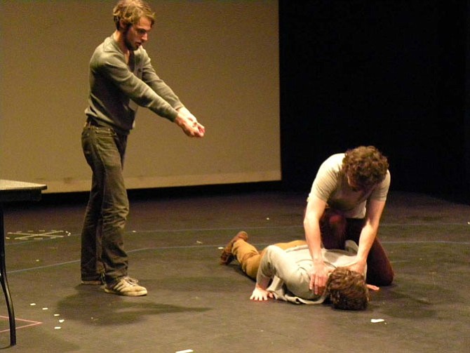 From left, Brandon Herlig, Sam Taylor and Eric Schlein rehearse the fight scene in Aaron Sulkin’s “Uniform,” which will be shown on Tuesday, Nov. 11 at the Johnson Center Cinema in Fairfax.