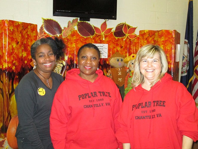 Parents, students, teachers and administrators — including (above, from left) Wanda Radler, PTA president; Sharon S. Williams, principal, and Holly Walker, assistant principal — celebrated at Poplar Tree’s Fall Festival last month.