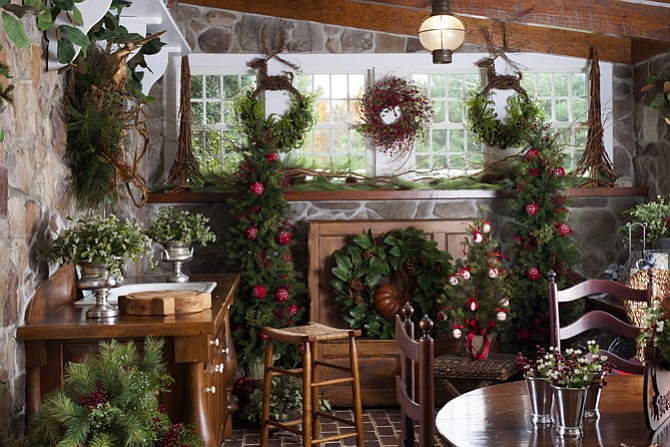 Custom Wreaths of Potomac, which is located on the bottom level of Linda Hobbins’ carriage house, has been transformed into a holiday wonderland.