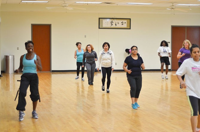 ZUMBA instructor Stephanie Baker leads a group exercise at the Herndon Community Center during the Nov. 8 open house. Herndon Community Center offers a number of different health and fitness classes as well as an indoor pool.