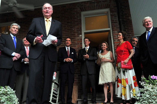 Former U.S. Ambassador to NATO David Abshire introduces Don Beyer and his wife Megan to guests at a party given at his Old Town residence in August of 2009. Beyer had been just been sworn in as U.S. Ambassador to Switzerland and Liechtenstein. Joining Ambassadors Abshire and Beyer on the porch were U.S. Sen. John Warner, SCAN founder David Cleary, former Virginia Gov. Chuck Robb, Don and Megan Beyer, Linda Robb and U.S. Rep. Jim Moran.