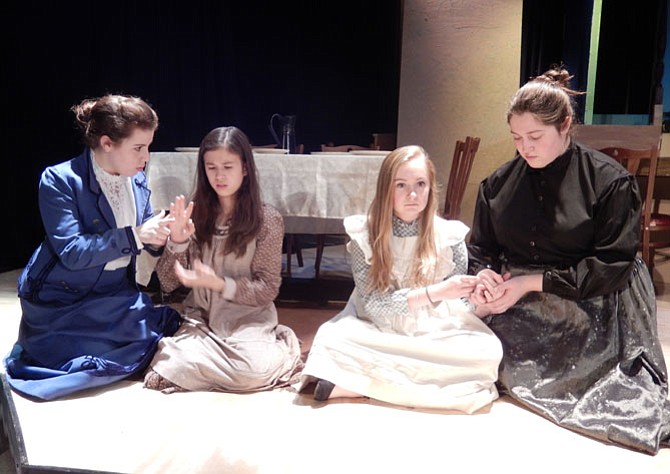 Teaching the alphabet: Double cast as Annie are (far left) Abby Rozmajzl and (far right) Sarah Giuseppe, with (in middle, from left) Isabella Whitfield and Meghan Kelly as Helen Keller.