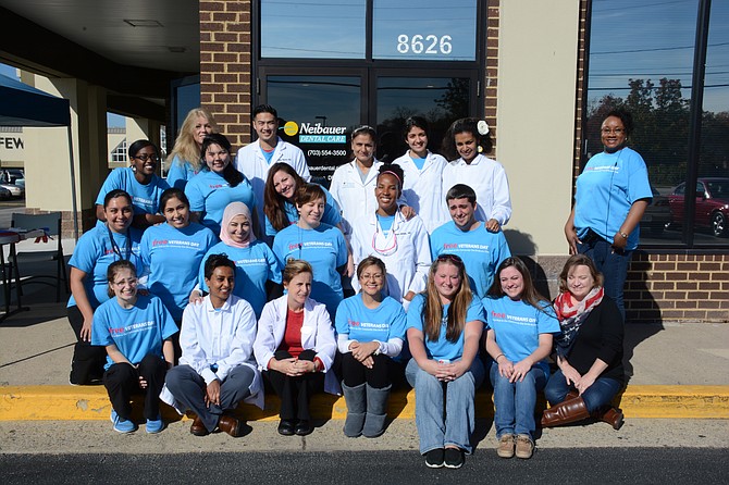 (Top, from left) Vivian Fletcher, Dr. Mike Nguyen, Dr. Navneet Dhillon, Dr. Ruchika Malhotra, Lily Tefferi, Cynthia Nabors (second row, from left) Tatiana Morton, Adriana Serra, Jennie Korniotes (third row, from left) Andrea Valencia, Christina Allen, Fatima Tarshi, Tiff'nni Bell, Dr. Jimani Mwendo, Dustin Crisler (bottom row, from left) Taylor Hales, Enat Legesse, Lisa Sheire, Mary Linarez, Teresa Evans, Jessica Butler and Lisa Butler. Members of the Neibauer Dental Care team and volunteers helped provide free dental service to veterans and the public.
