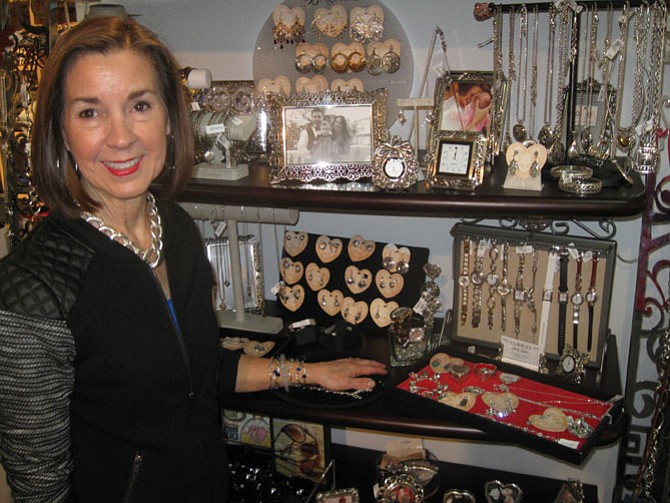 Judy Ryan of Fairfax with her gift collection by Brighton, which includes clocks ranging from $36 to $50 and Christmas jewelry.
