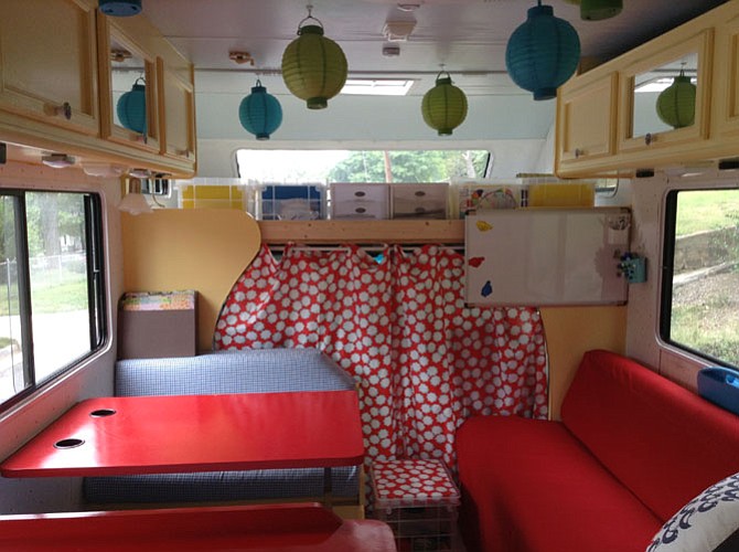Anne Thomas helps students using a mobile classroom, which she says provides a specialized learning environment that is both a fun and calm setting for learning.
