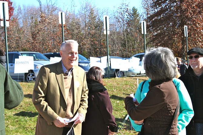 Al Johnson, who lost the Republican primary on Saturday, talking to voters outside the polls.