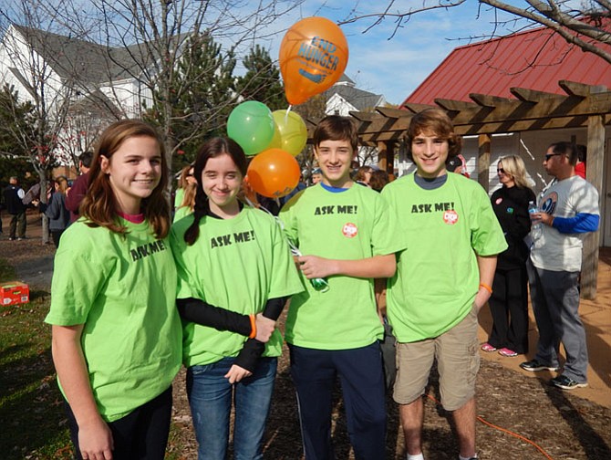 Two sets of twins from Thoreau Middle help at the walk. (From left) are Lianna Williams, Hannah Rupy, Noah Rupy and Miller Williams.