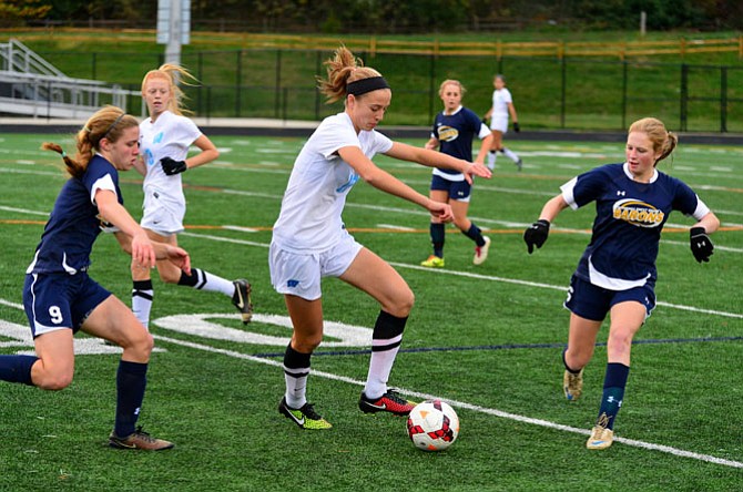 Sophomore forward Abby Meyers, seen against B-CC in the section final on Oct. 31, and the Whitman girls’ soccer team finished the 2014 season with an undefeated record.