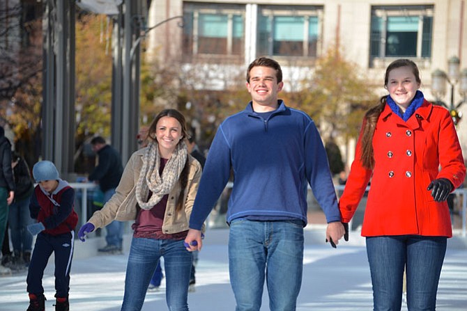 From left -- Rylee McKeon, James Drasbeck and Caroline Drasbeck from Great Falls, decided that literally sticking together was the best way for everyone to stay upright on the ice. Their theory seemed to work.
