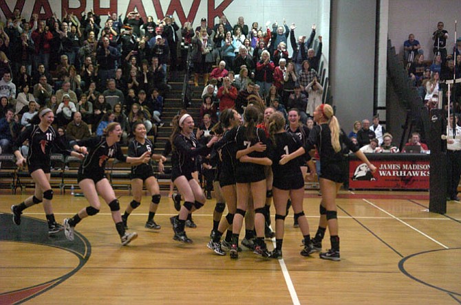 Madison volleyball players celebrate their sweep of Osbourn Park in the region semifinals on Nov. 15.