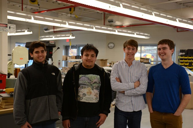 (From left) Thomas Jefferson seniors Andrew Haymaker of Falls Church, Justice Francis of Springfield, Nick Brady of Great Falls and Thomas Rogers of McLean enjoy the improved lighting, roominess and three-dimensional printers in the new transportation lab.
