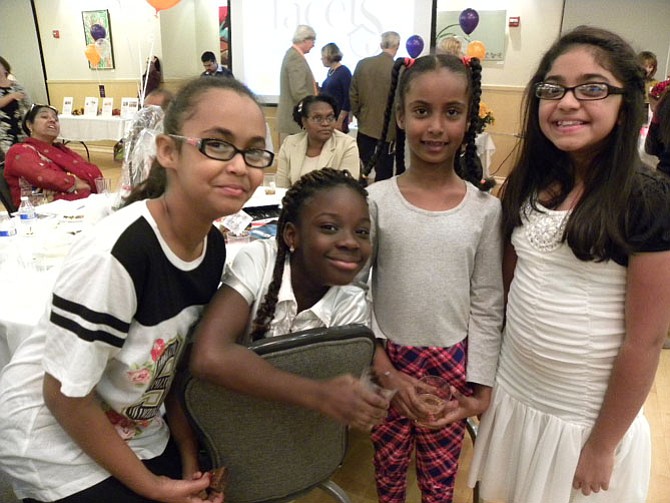 From left, Lina Bedawi, 11, Naana Boateng, 9, Ruba Bedawi, 7, Zoya Khan, 10, of Fairfax entertain guests with a choreographed dance at Facets’ 15th Annual Taste of Fall on Saturday, Nov. 15 in Fairfax.
