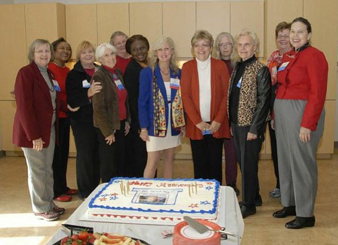 The Fairfax County History Conference Planning Committee with a 10th Anniversary Cake to celebrate 10 years, from left: Barbara Naef, Esther McCullough, Naomi Zeavin, Mary Lipsey, Anne Barnes, Lynne Garvey-Hodge, Rachel Rifkind, Dr. Liz Crowell, Carole Herrick, Susan Gray and Jenee Lindner. Not pictured: Mike Irwin and Phyllis Walker Ford.
