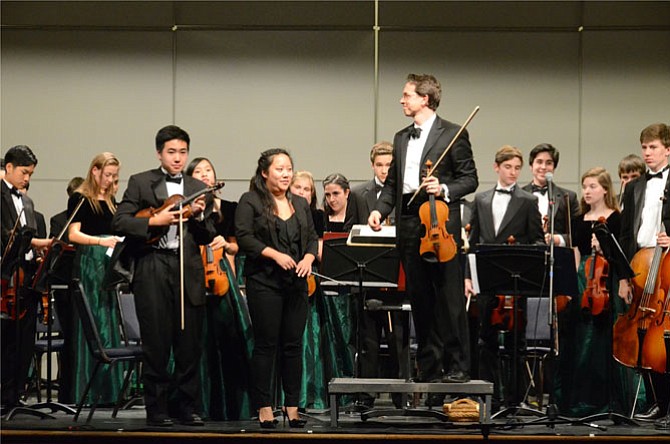 At the finale of "An Evening in Vienna," the Concert Orchestra and Langley HS Orchestra Directors Elizabeth Leung and Dr. Scott McCormick acknowledge applause.
