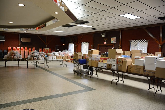 Thanksgiving food packages for over 460 families sit in the Moose Family Center in Lorton, ready for distribution.
