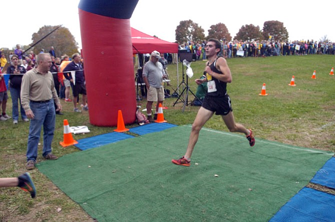 Westfield senior Johnny Pace crosses the finish line at the 6A North region championship meet on Nov. 5 at Burke Lake Park.