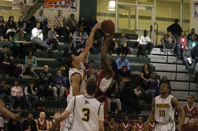 Wakefield’s Dominique Tham, left, blocks a shot against Mount Vernon last season.