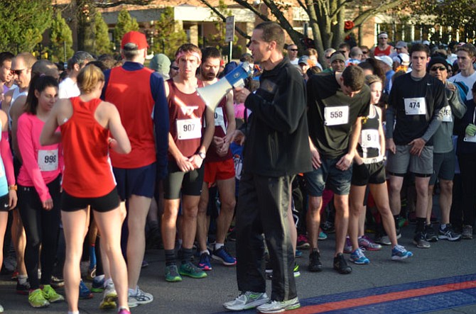 Wolf Gottschalk uses a loudspeaker to tell participants in the Herndon Turkey Trot 5K about the race course. Over 1,100 runners, eight elementary school running groups, 50 plus volunteers, Town of Herndon staff, and many local and national sponsors contributed to the success of the race.