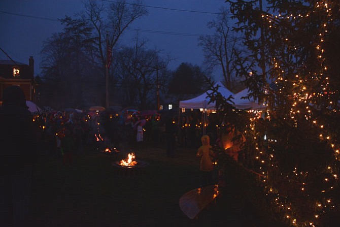 Fires and electric candles blazed while choirs from Osbourn Park and Patriot High Schools led Christmas carol sing-a-longs at the Clifton Christmas tree-lighting. 