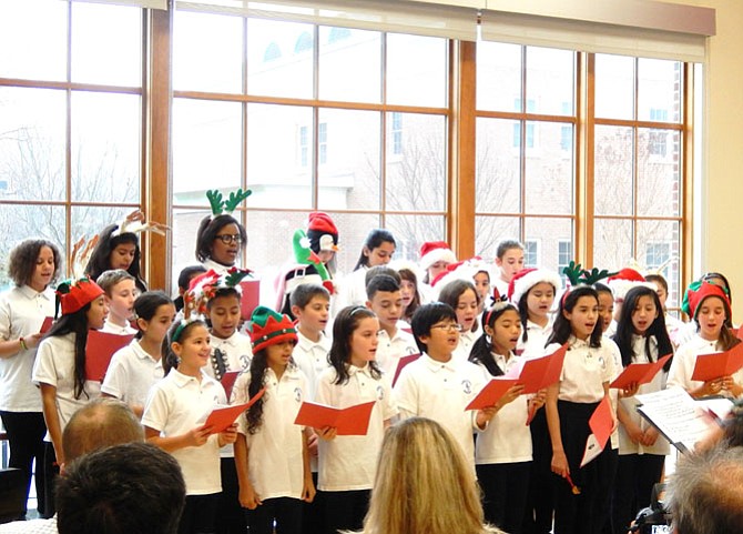Daniels Run Elementary fifth- and sixth-graders perform Christmas carols for the crowd.
