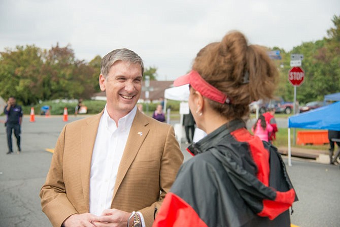 Republican candidate for the 34th District House of Delegates Craig Parisot talks to a concerned citizen on the campaign trail.
